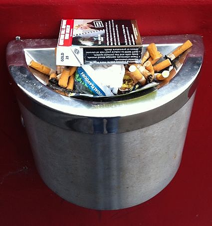 This ashtray has been turned into a trash bin.  This can't happen with Eco-Pole Ashtrays advanced trash-proof design