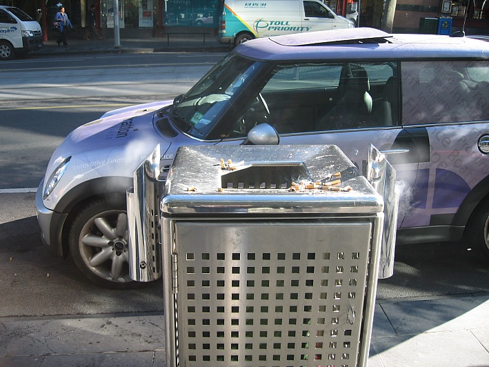 Butt Out Australia Ashtrays - 2 x ashtrays on fire in Bourke St, Melbourne CBD